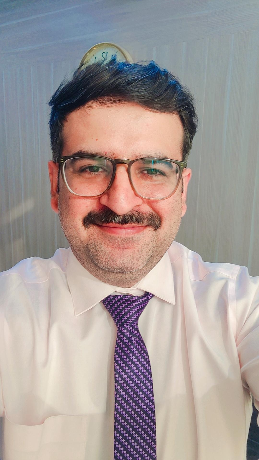 Prateek Bhatia in formal attire