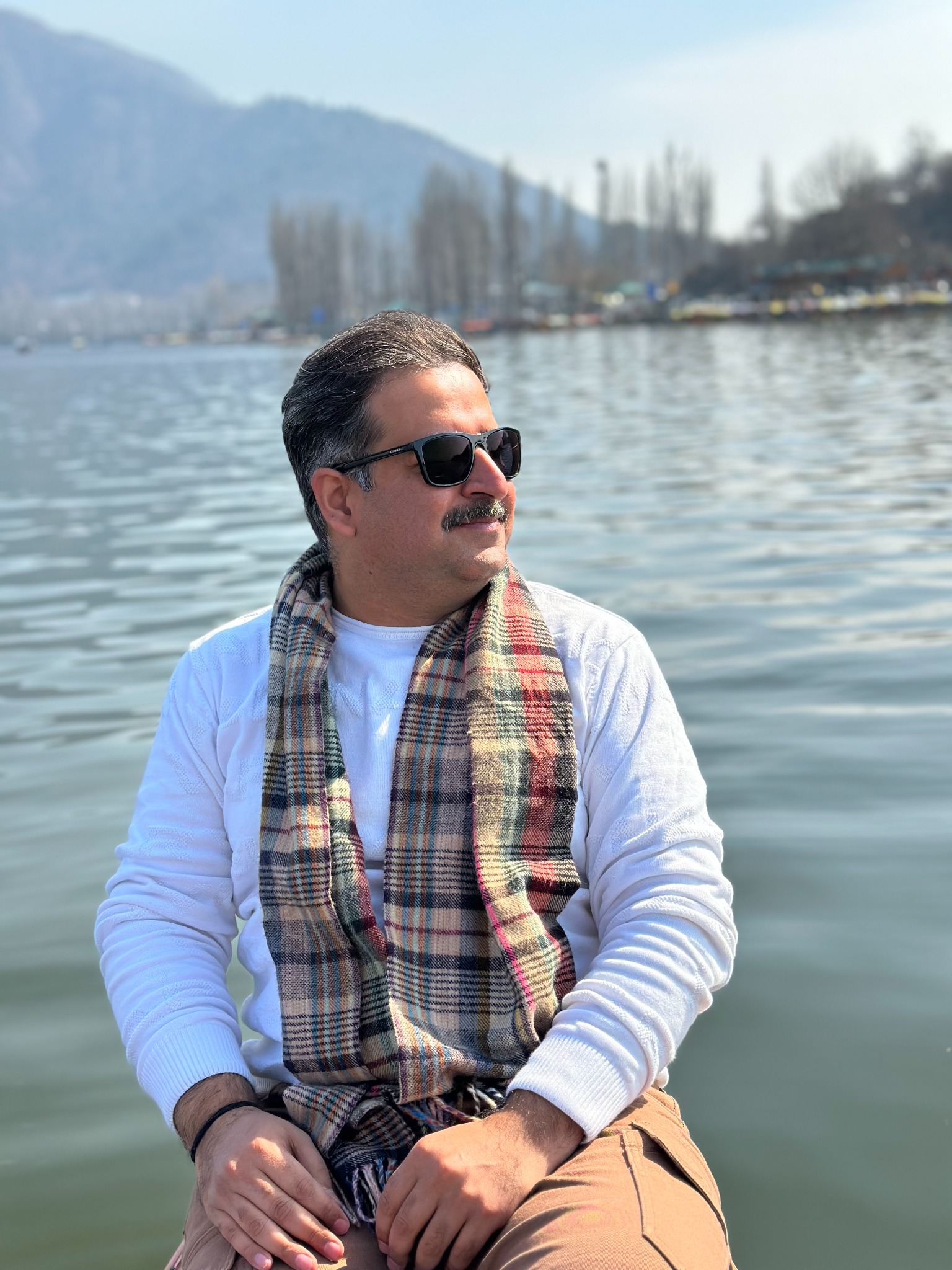 Prateek Bhatia beside a lake